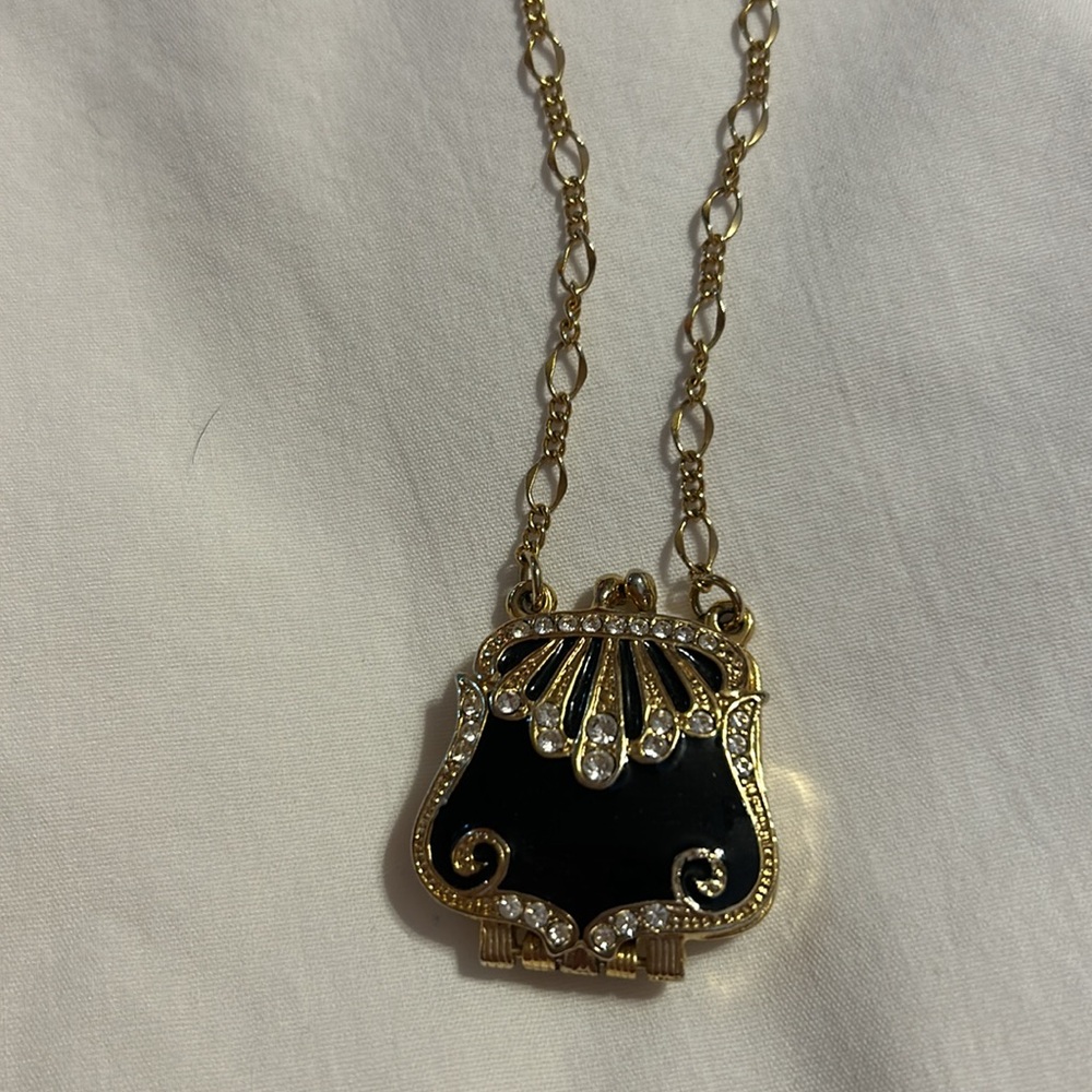 Locket shaped like a pocket book